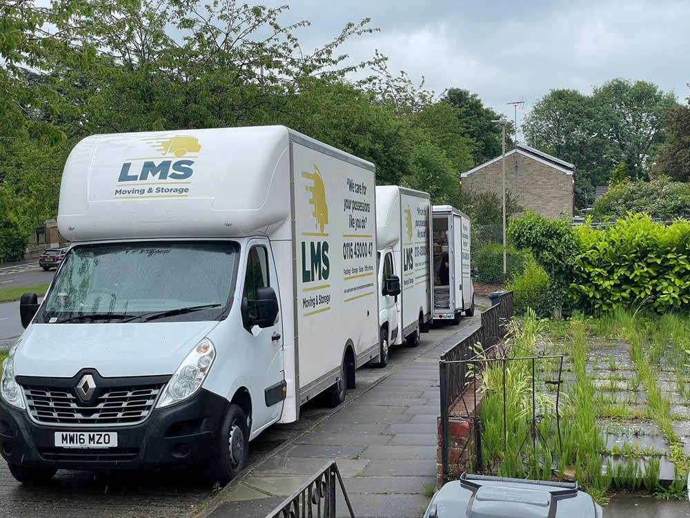 LMS home removal vans parked outside house