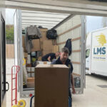 removal van being loaded with packed boxes