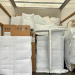 carefully packaged goods in the back of a lorry ready to move to a new home