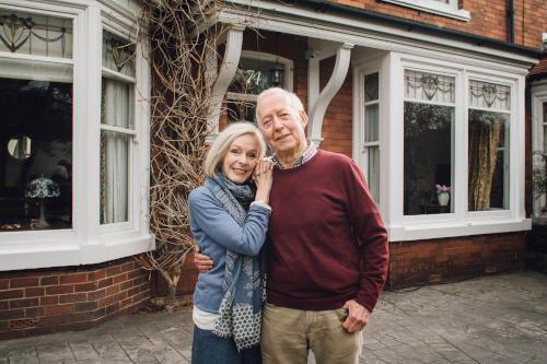 retirees outside their house